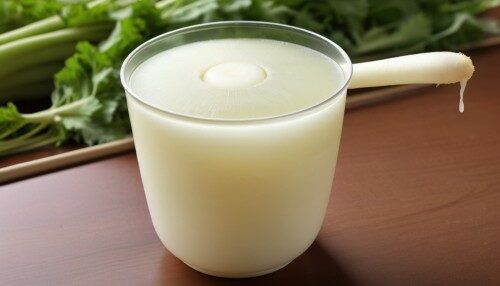 daikon juice in a cup, next to a large daikon