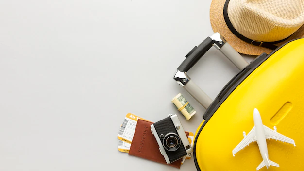 Free Photo | Flat lay yellow luggage with copy-space