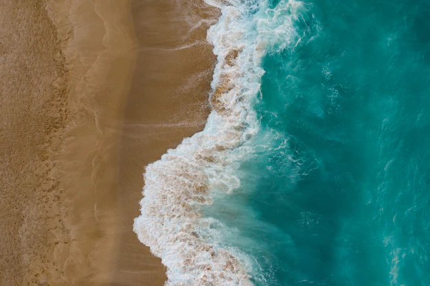 Free Photo | Top view of sand meeting seawater
