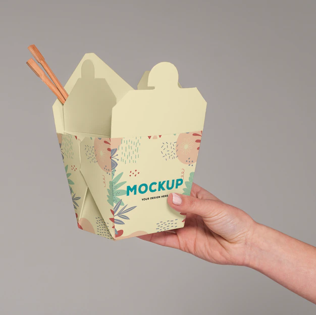 Free PSD | Close up hand holding food box