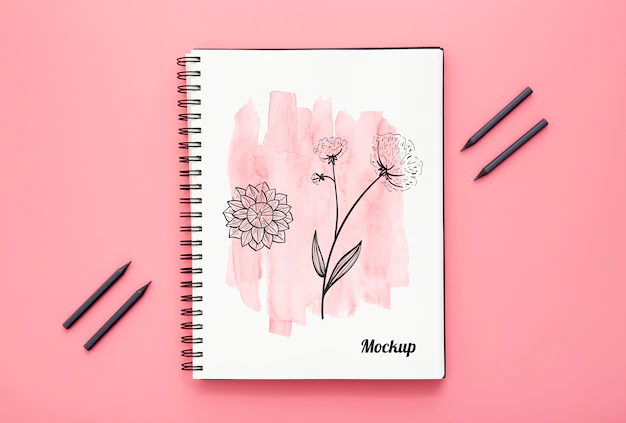 Free PSD | Flat lay of desk surface with notebook and pencils