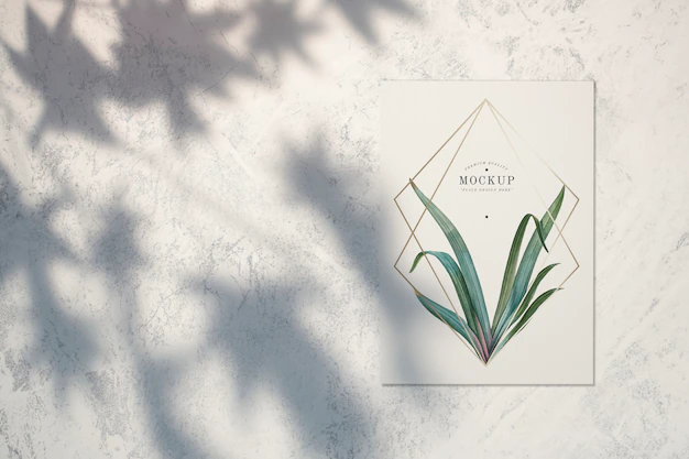 Free PSD | Premium quality card mockup with leaves and golden frames