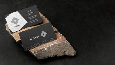 Free PSD | Stationery mock-up on dark concrete with rugged rock