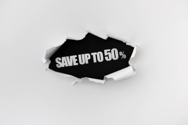 Free PSD | Torn hole in the white wall of paper on a black background