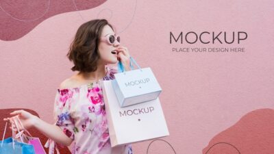 Free PSD | Woman holding mock-up paper bags