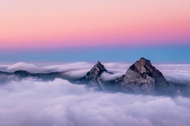 Free Photo | Beautiful aerial shot of fronalpstock mountains in switzerland under the beautiful pink and blue sky