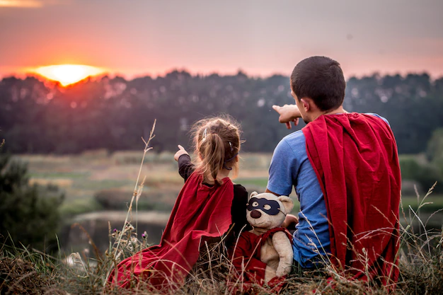 Free Photo | Little girl with dad dressed in super heroes, happy loving family
