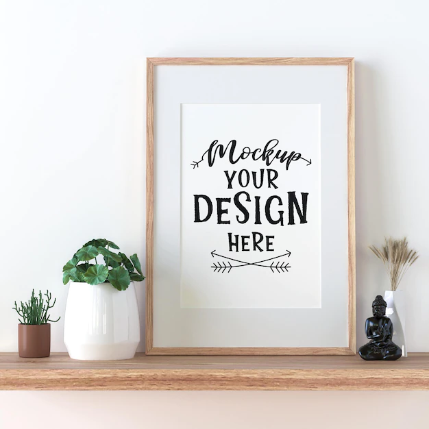 Free PSD | Poster frame mockup on the wall with plant