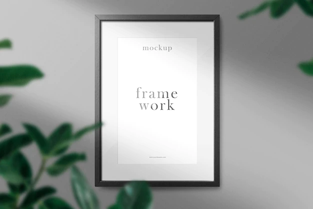 Free PSD | Clean minimal frame mockup on the wall with leaves