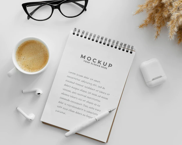 Free PSD | Arrangement with mock-up notepad on a desk