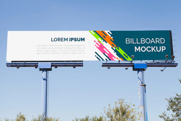 Free PSD | Billboard mockup on blue sky background