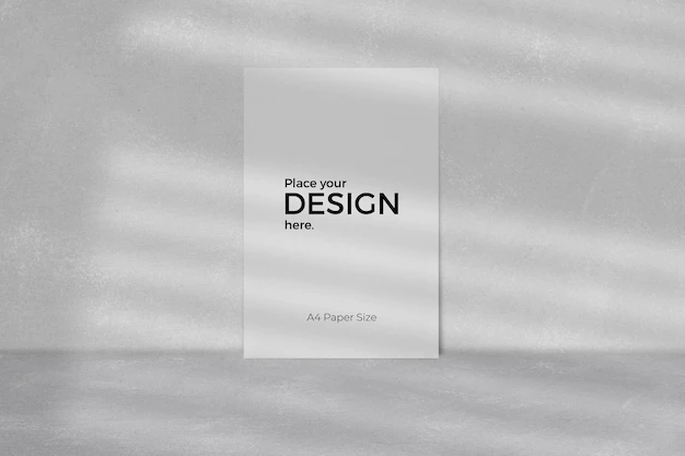 Free PSD | Blank sheet editable template in front of grey wall