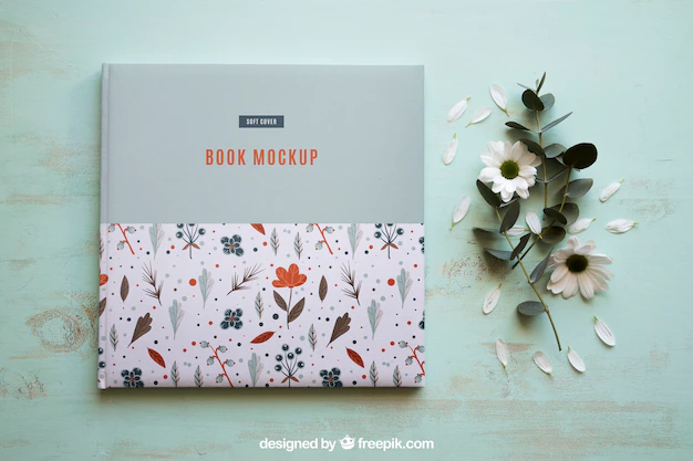 Free PSD | Book mockup next to flowers