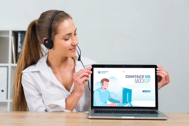 Free PSD | Call center operator looking at a mock-up laptop