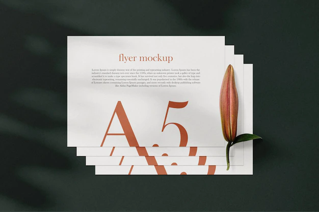 Free PSD | Clean minimal a5 flyer mockup on background with leaves. psd file.