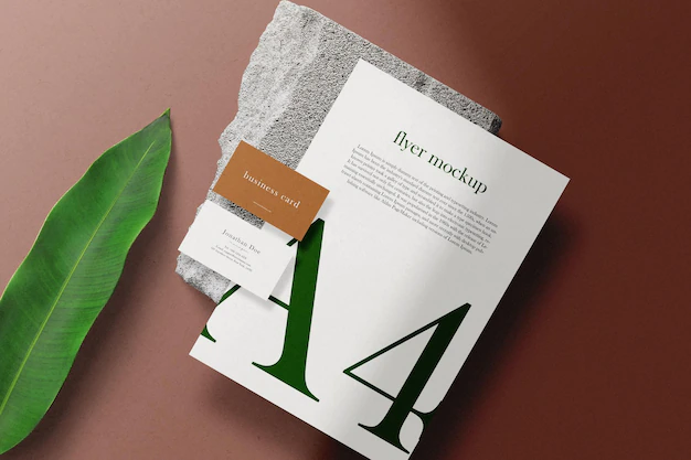 Free PSD | Clean minimal flyer mockup on paper a4 with block and leaf
