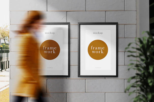 Free PSD | Clean minimal frame mockup on the wall with people walking and plant background psd file