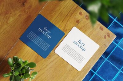 Free PSD | Clean minimal square flyer mockup on top wooden with plant