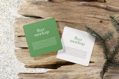 Free PSD | Clean minimal square flyer mockup on wooden bench with conifer background