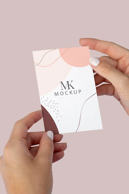 Free PSD | Close up hands holding business card flat lay