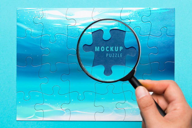 Free PSD | Close-up man holding magnifying glass