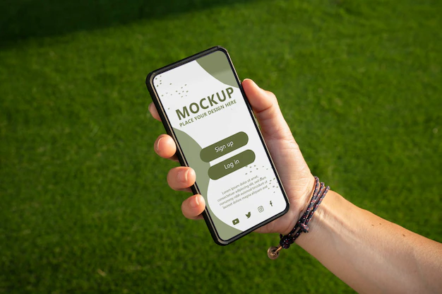 Free PSD | Close up on hand using phone mockup