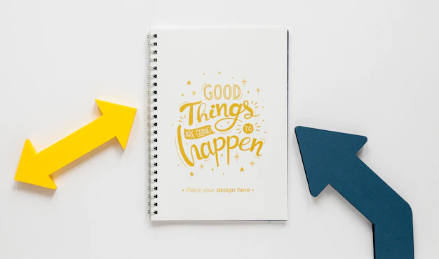 Free PSD | Colourful arrows and notebook mock-up