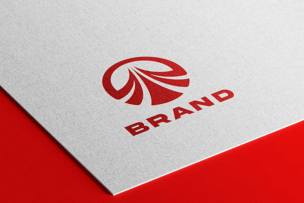 Free PSD | Debossed red logo mockup on white paper