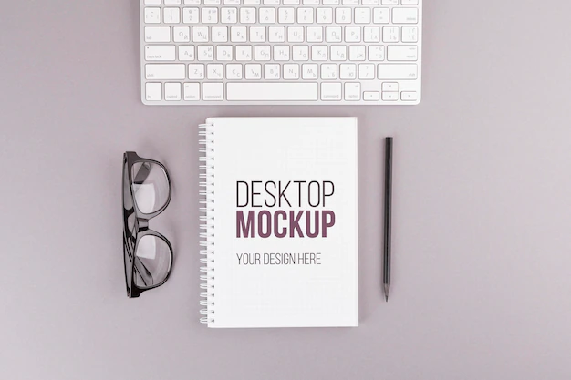 Free PSD | Desk concept with notebook and glasses