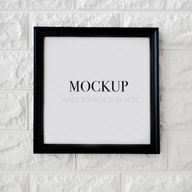 Free PSD | Empty square frame for mock up on a brick wall