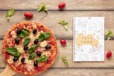 Free PSD | Flat lay of pizza on wooden background