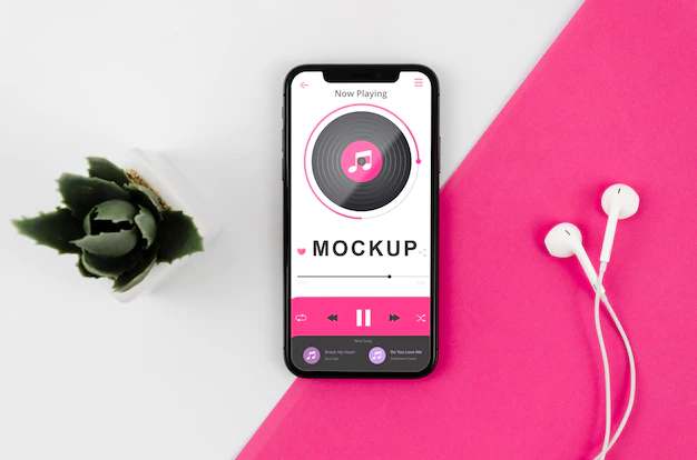 Free PSD | Flat lay smartphone mock-up with earphones and plant