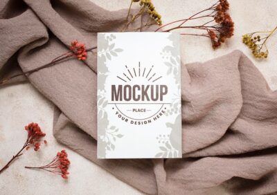 Free PSD | Flay lay autumn mock-up with flowers on grey cloth