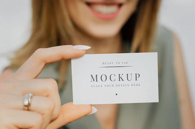 Free PSD | Friendly woman carrying a business card mockup
