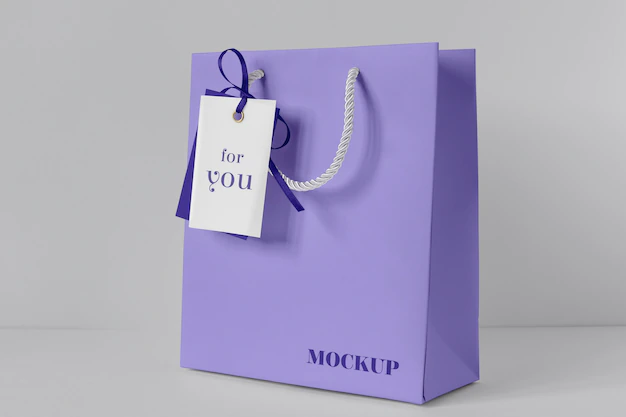 Free PSD | Front view of paper shopping bag mock-up with paper tag