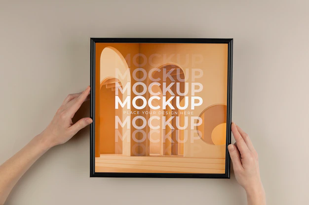 Free PSD | Hands holding dark frame mockup above view