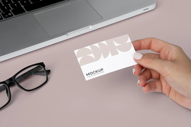 Free PSD | High angle close up hand holding business card