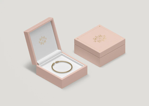 Free PSD | High angle pink jewelry box with golden bracelet