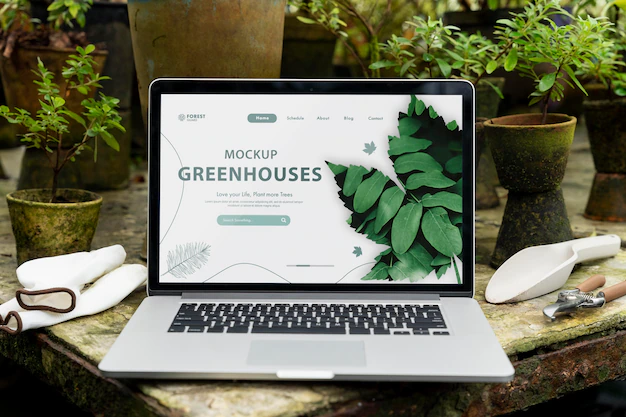 Free PSD | Laptop mockup in a greenhouse