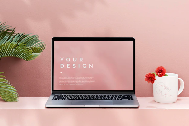 Free PSD | Laptop mockup with a pastel pink wall