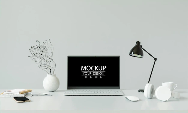 Free PSD | Laptop on desk in workspace mockup