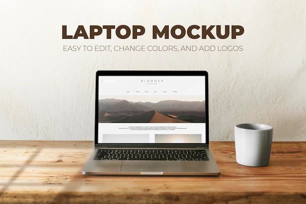 Free PSD | Laptop psd mockup with coffee mug on wooden table