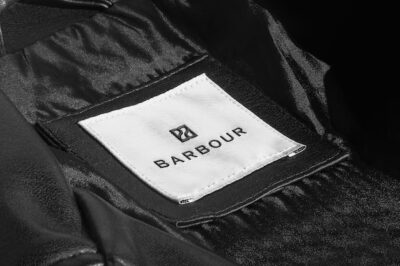 Free PSD | Logo mockup black leather jacket label