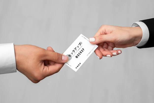 Free PSD | Men holding a business card mock-up