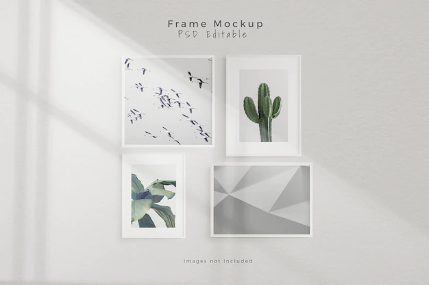 Free PSD | Mockup four empty photo frame mockup in empty white wall room