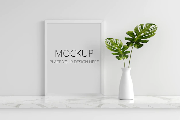 Free PSD | Monstera plant in vase with picture frame mockup
