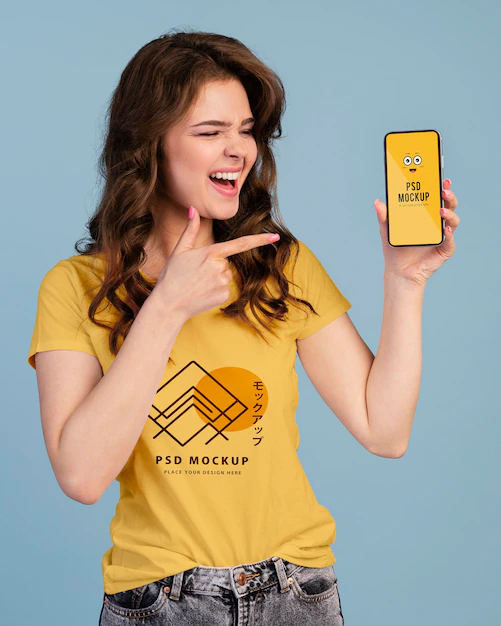 Free PSD | Person with excited expression pointing to phone mockup