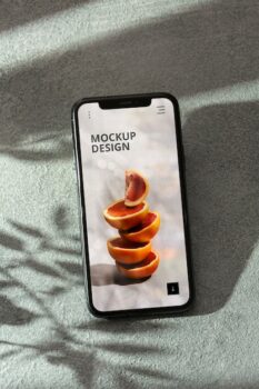 Free PSD | Phone on concrete wall with shadow