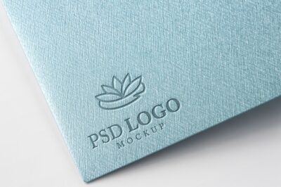Free PSD | Pressed logo mock-up on paper corner close-up