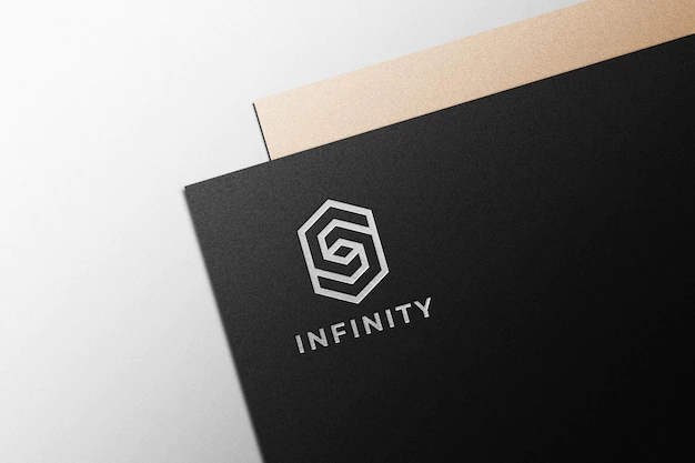 Free PSD | Silver logo mockup on black paper